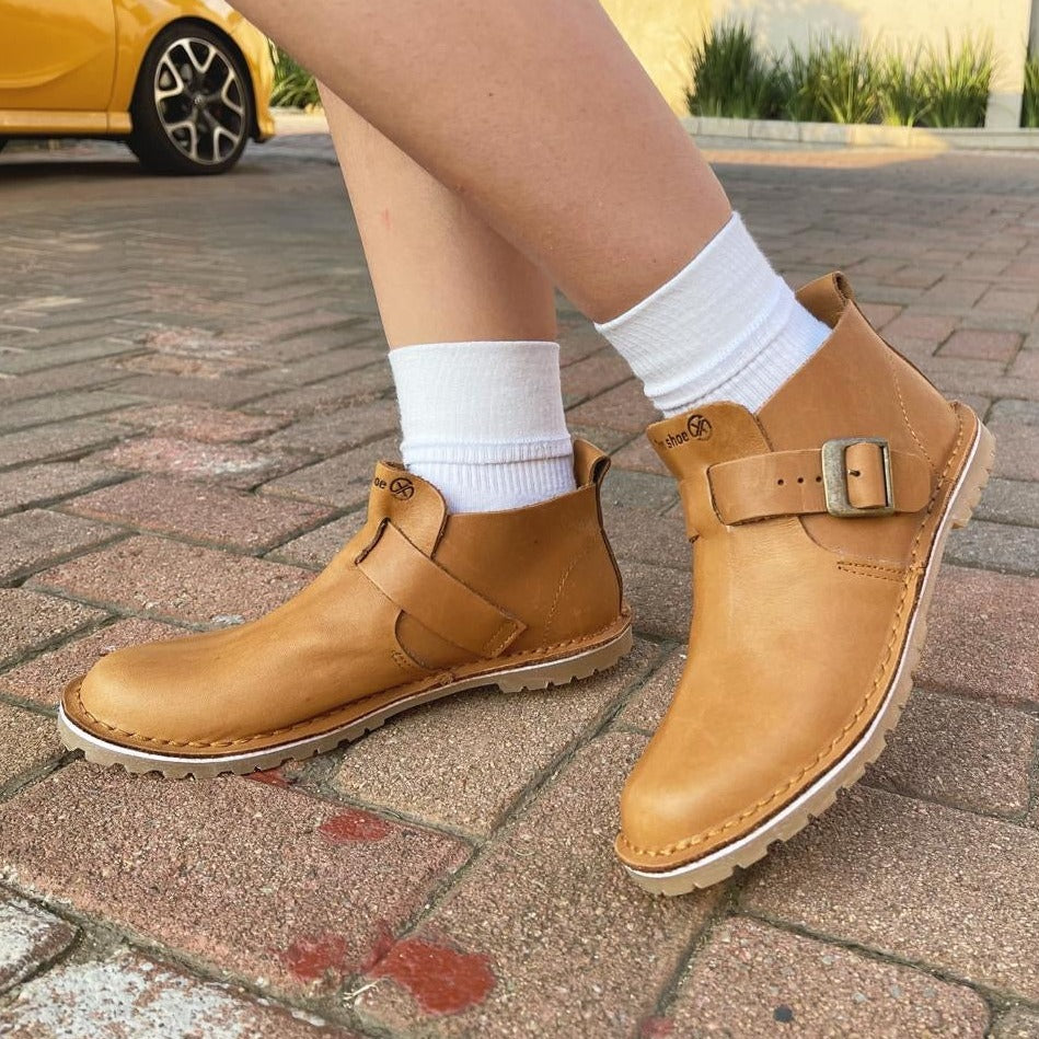 crossover buckle bootie