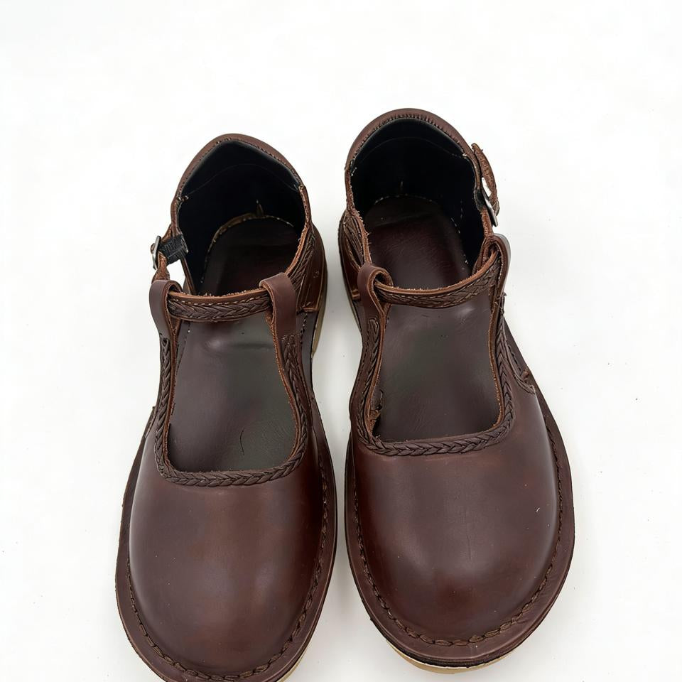 Pair of brown leather shoes on a white background