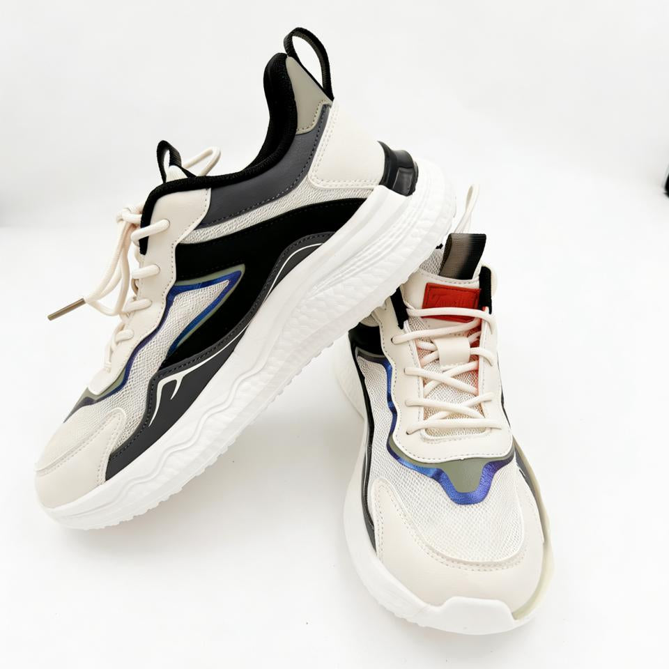 Pair of white sneakers with black and blue accents on a light gray background
