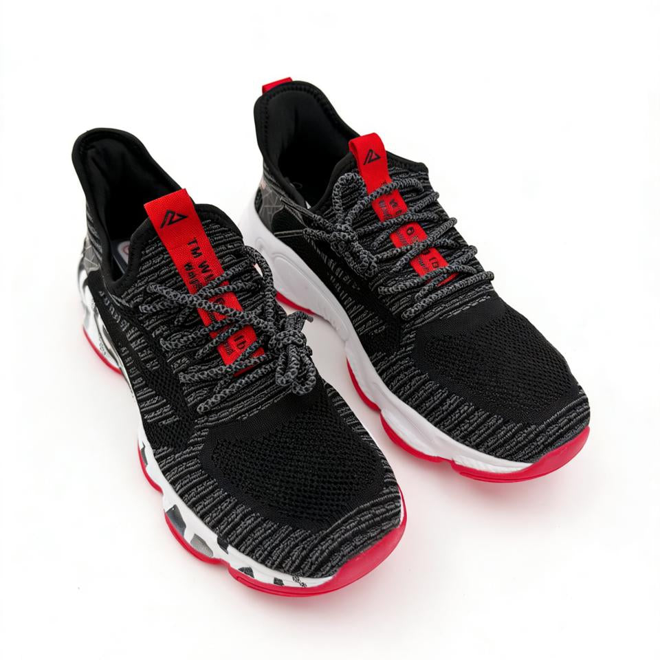 Black and red athletic shoes on a white background