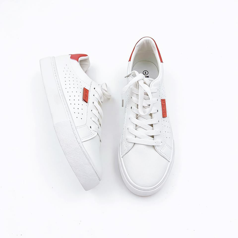 White sneakers with red accents on a white background